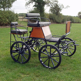 Mini 4 Wheeler with polyurethane tyres, wood cladding and rear grooms seat 